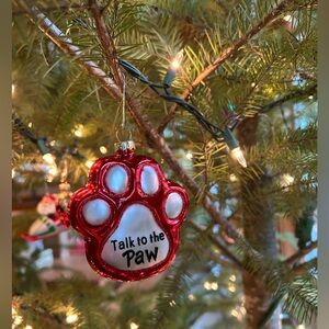 Glass Red Dog Paw Print Ornament. Size 4 inches high x 3.5 wide.